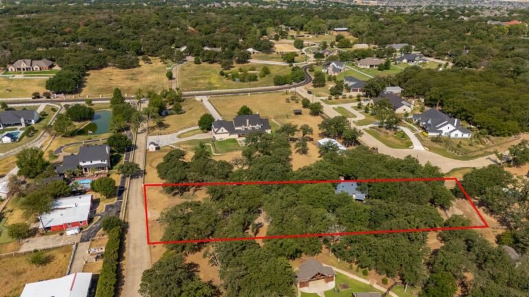 Aerial view of the 1.58-acre lot with property lines outlined at 1311 Mount Gilead Rd, Keller TX