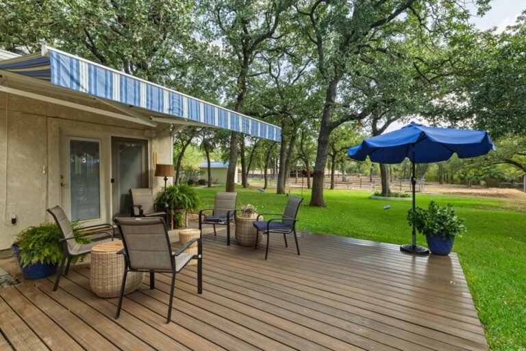Back deck with patio seating at 1311 Mount Gilead Rd, Keller TX