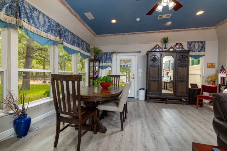 Dining area with windows and French doors at 1311 Mount Gilead Rd, Keller TX