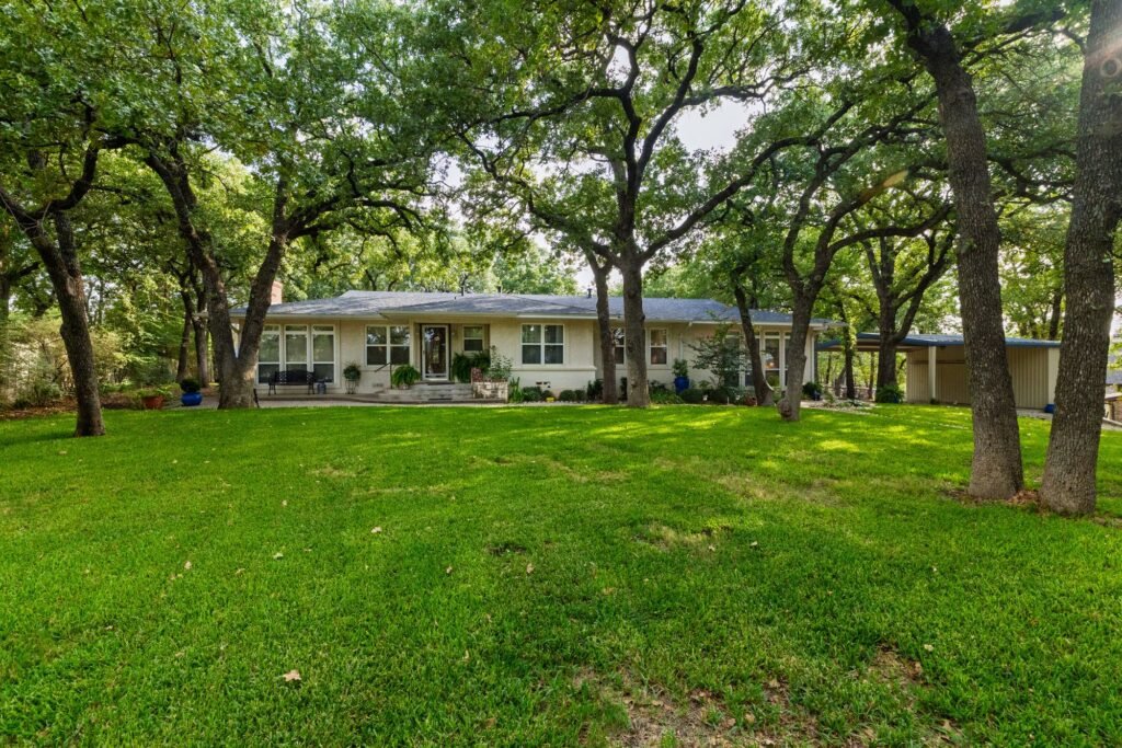 Front of 1311 Mount Gilead Road in Keller, TX, a ranch-style home under mature trees