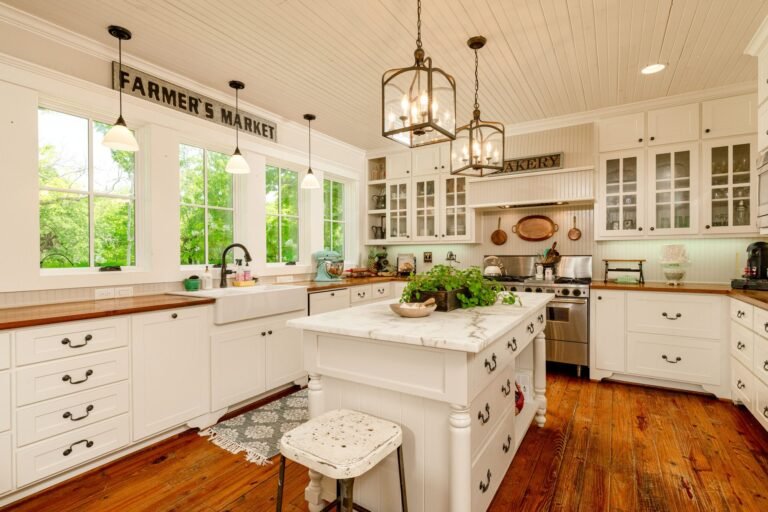 Farmhouse kitchen with large island and pendant lights at 1331 Bancroft Road, Keller TX