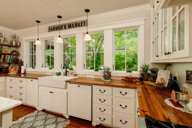 Kitchen with farmhouse sink and a wall of windows overlooking the acreage at 1331 Bancroft Road, Keller TX
