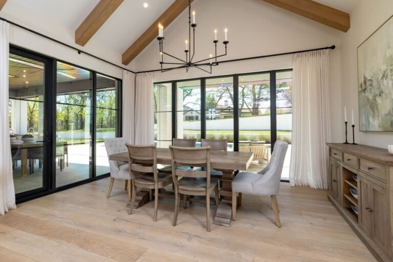 Dining room with beamed vaulted ceiling and floor-to-ceiling windows at 1412 Chelsea Rae Lane, Keller TX