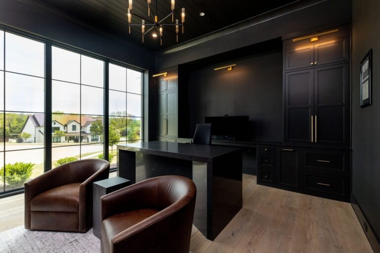 Private home office with dark built-ins and large windows at 1412 Chelsea Rae Lane, Keller TX
